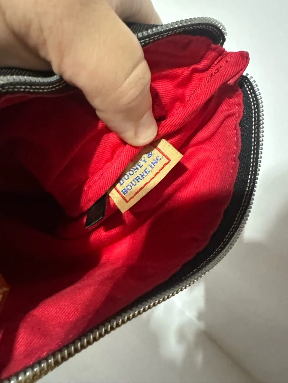 Dooney & Bourke North South Triple Zip Black Crossbody with Brown Leather Strap